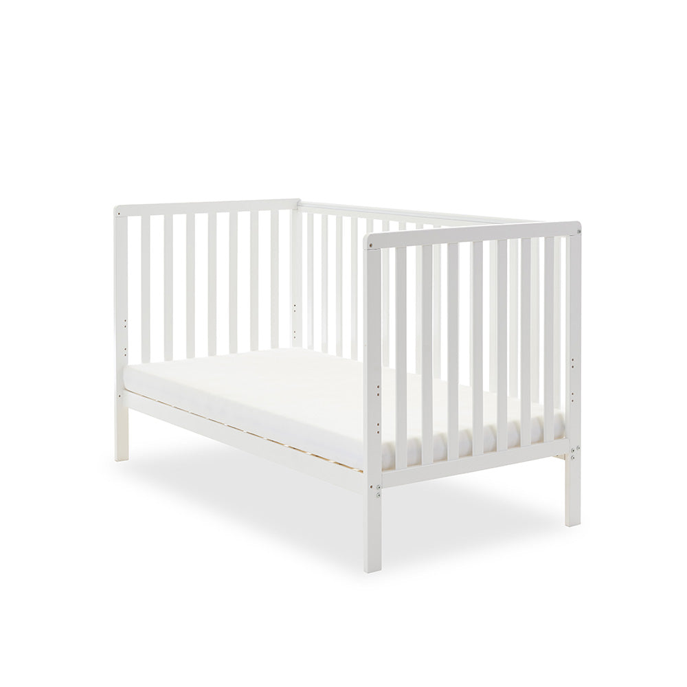 White cot bed, in day bed mode for with 1 side removed.