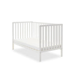 White cot bed, in day bed mode for with 1 side removed.