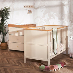 Cot Bed & matching changing unit with 3 drwaers.