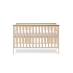 Cot Bed with rails on the sides & solid ends with wooden trim on top. Base on the new born setting.