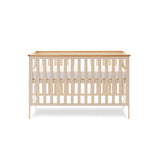Cot Bed with rails on the sides & solid ends with wooden trim on top. Base on the new born setting.