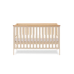 Cot Bed with open sides & solid sodes with wood trim on top of all 4 sides.