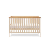 Cot Bed with open sides & solid sodes with wood trim on top of all 4 sides.
