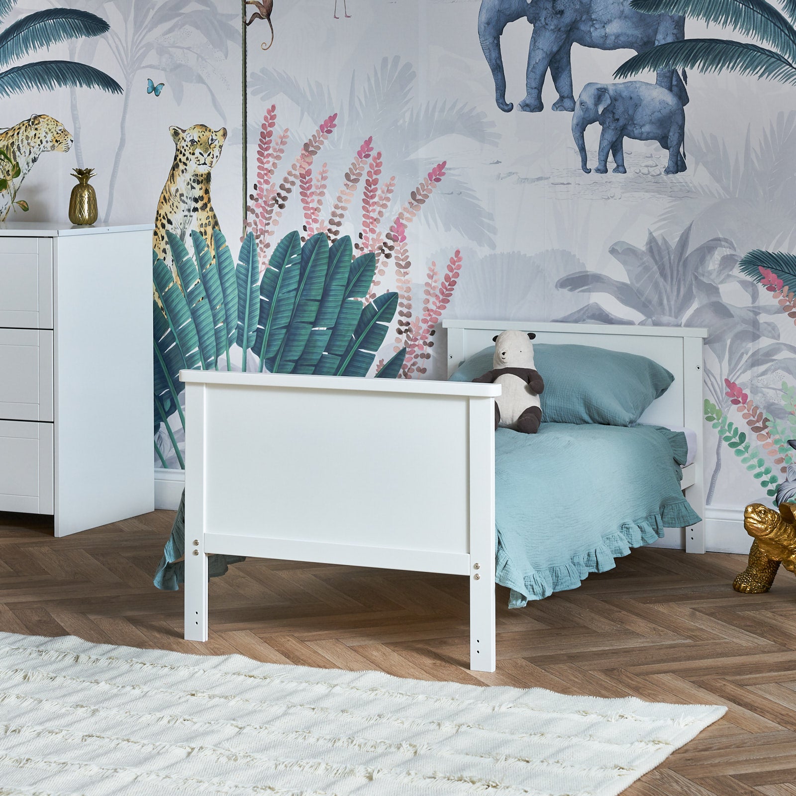 Mini Cot Bed, converted into a toddler bed by removing the side & lowering solid ends.