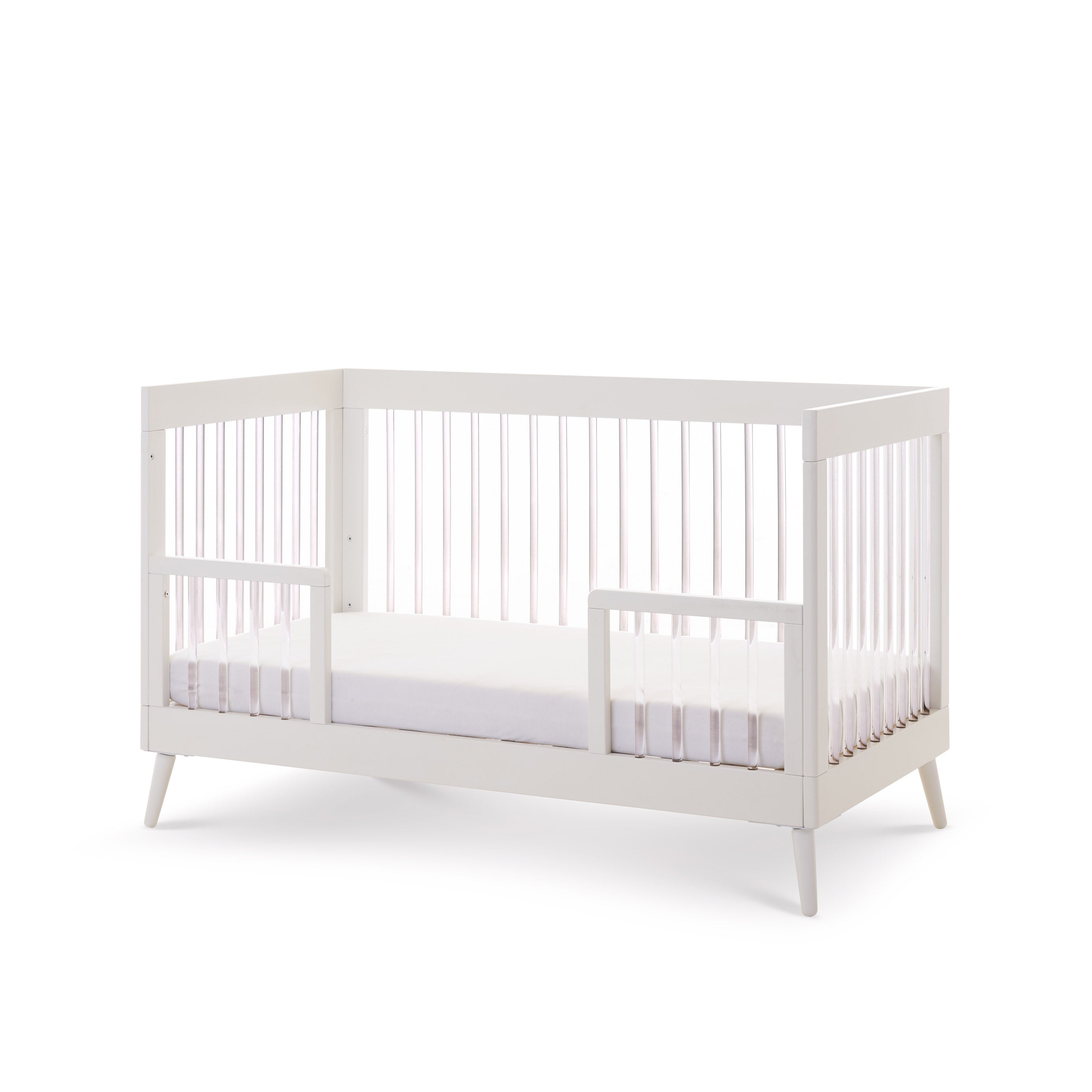 Cot Bed converted with toddler rails for toddler bed