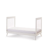 Cot Bed turns into a toddler bed with acrylic rails