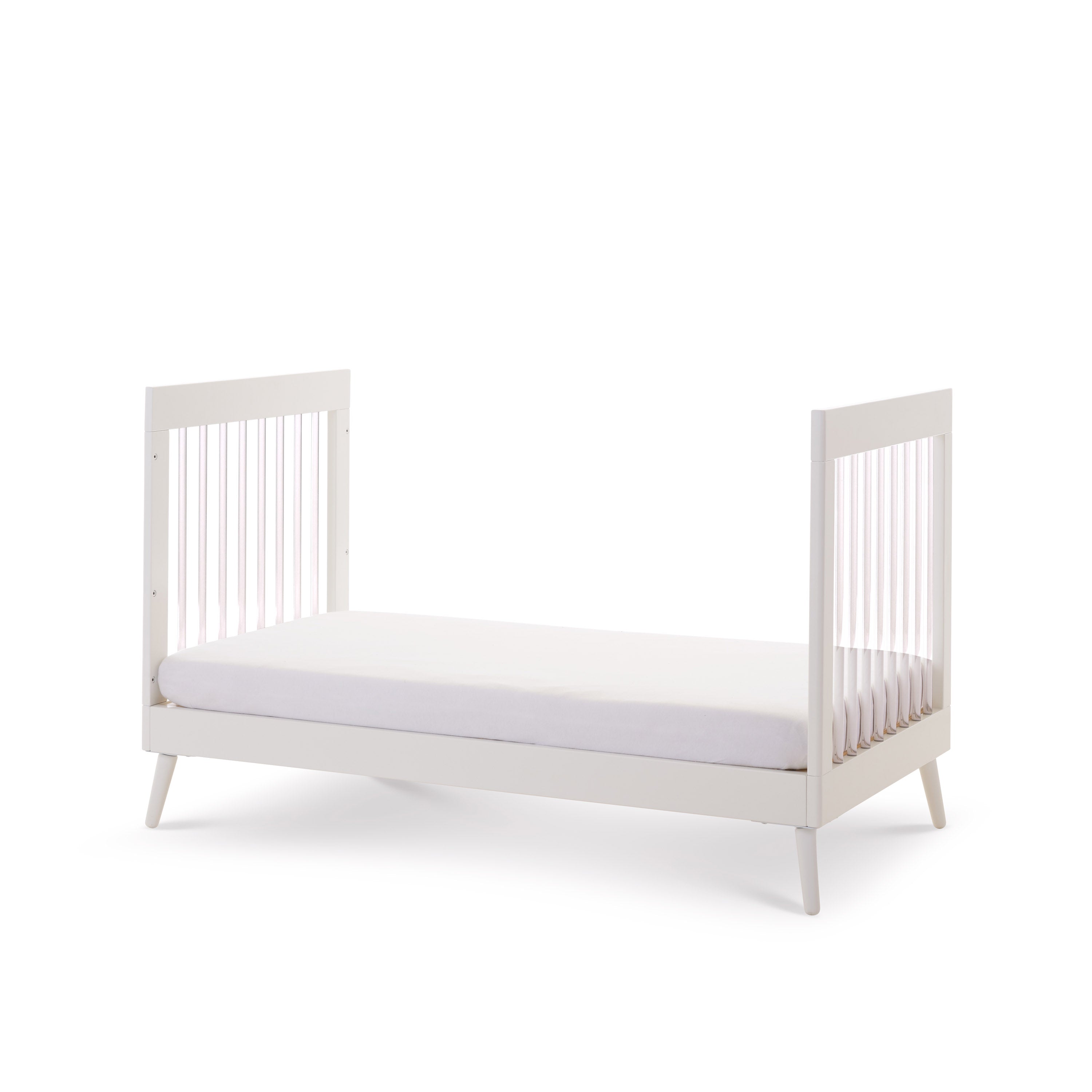 Cot Bed turns into a toddler bed with acrylic rails