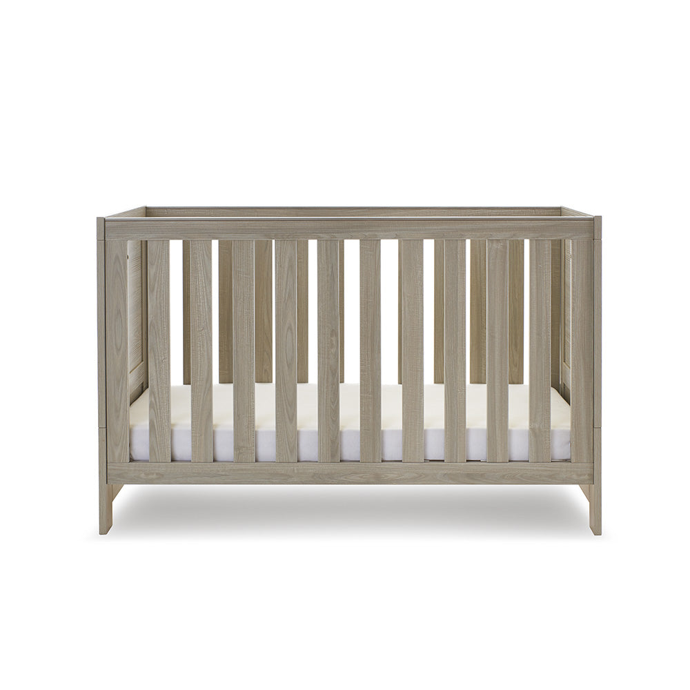 Cot Bed with solid sides, at lowest setting