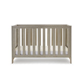 Cot Bed with solid sides, at lowest setting