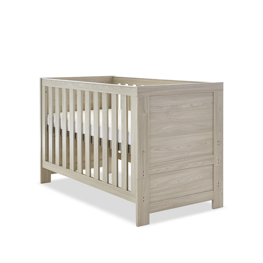 Cot Bed with solid ends, base at new born setting