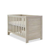 Cot Bed with solid ends, base at new born setting