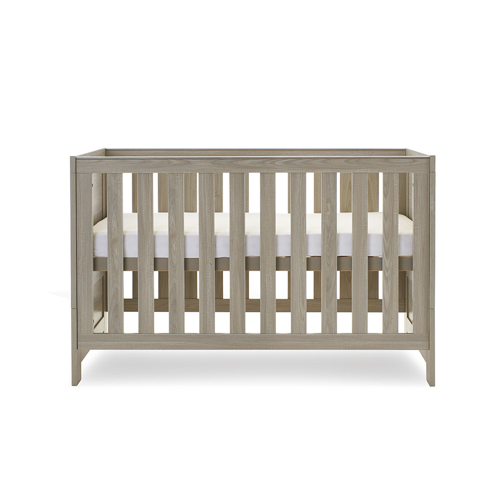 Cot Bed with solid ends, base at middle setting.