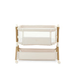 Obaby Cloud Bedside Crib in oatmeal colour with storage basket underneath designed to be placed beside a bed.