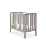 Compact Cot with base on the lwest setting, teething rail on 2 sides, rails on all 4 sides.