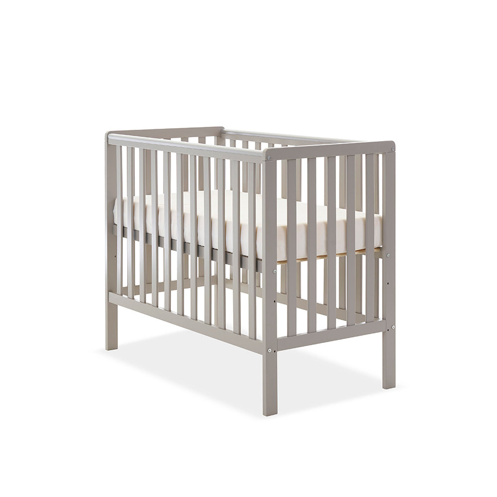 Compact cot with base on the new born level. with rials on all 4 sides. teething rail on 2 sides.