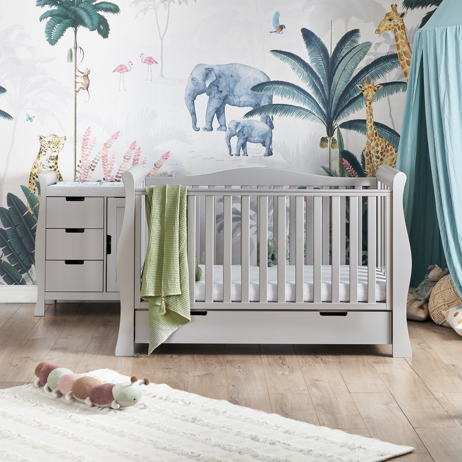 Sleigh 2 Piece Nursery Furniture Set includes cot bed with curved ends with open rails, back rail have curve in the middle, front rail has teething rail. Under Drawer included with cut out handles.