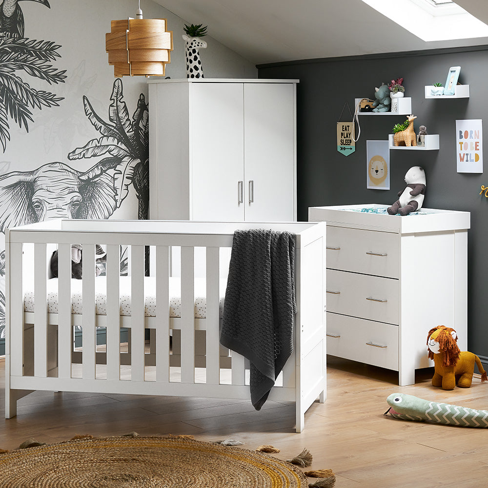 3 Piece nursery set includes cot bed with solid end & teething rail, changing unit has 3 drawers with metal handles & removable changing top, wardrobe has 2 doors & drawer at the bottom.