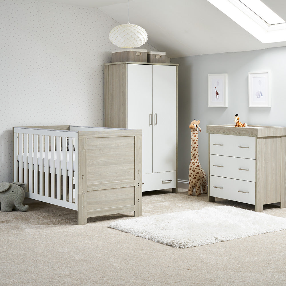 3 Piece Nursery Set includes cot bed with solid ends, teething rails & base in on new born setting, matching changing unit with 3 drawers with metal handles with removable changing top & wardrobe with 2 doors, a drawer and metal handles.