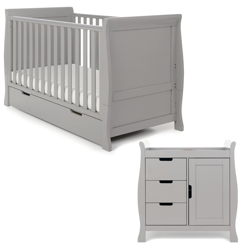 Sleigh 2 piece nursery furniture set, cot bed with curved edge, solid ends with teething rails on sides. Base on the lowest setting. Under drawer included with cut out handles. Closed changing unit with curved edges, drawer on left hand side & door on the right hand side.