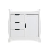 Slight changing unit, with curved sides, 3 drawers ont he left hand side & door on the right hand side all with cut out handles.