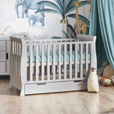 Sleigh Mini Cot Bed with rails on all 4 sides, curved ends & fitted teethign rails on the sides, under drawer included with cut out handles.