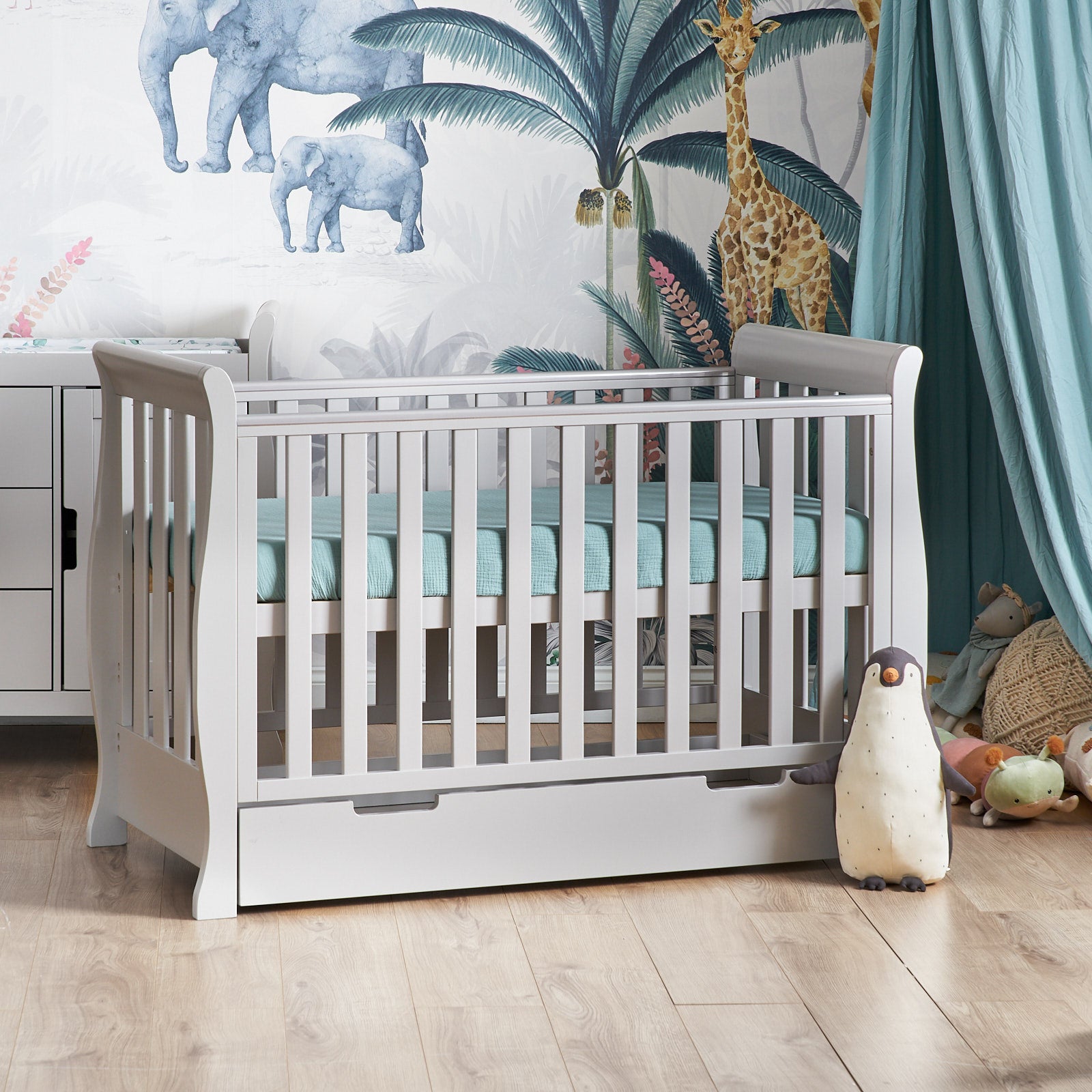 Sleigh Mini Cot Bed with rails on all 4 sides, curved ends & fitted teethign rails on the sides, under drawer included with cut out handles.