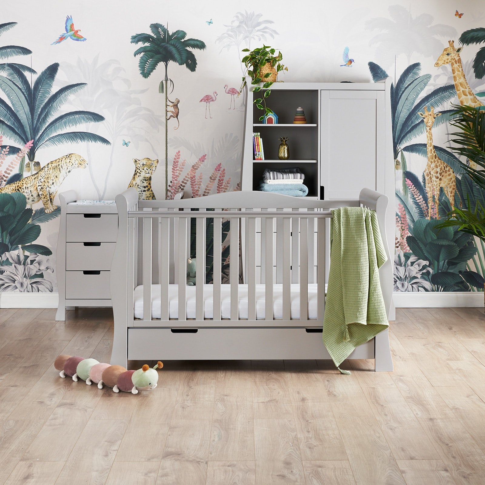 Sleigh 3 Piece nursery furniture set, cot bed has curved open sides, curve on the back panel & teething rail on the front rial, with under drawer included. Changing unit has curved sides, 3 drawers & door on the right hand side. Wardrobe has matching curved sides, 3 display shelves & drawers underneath, full length with cut out handles.