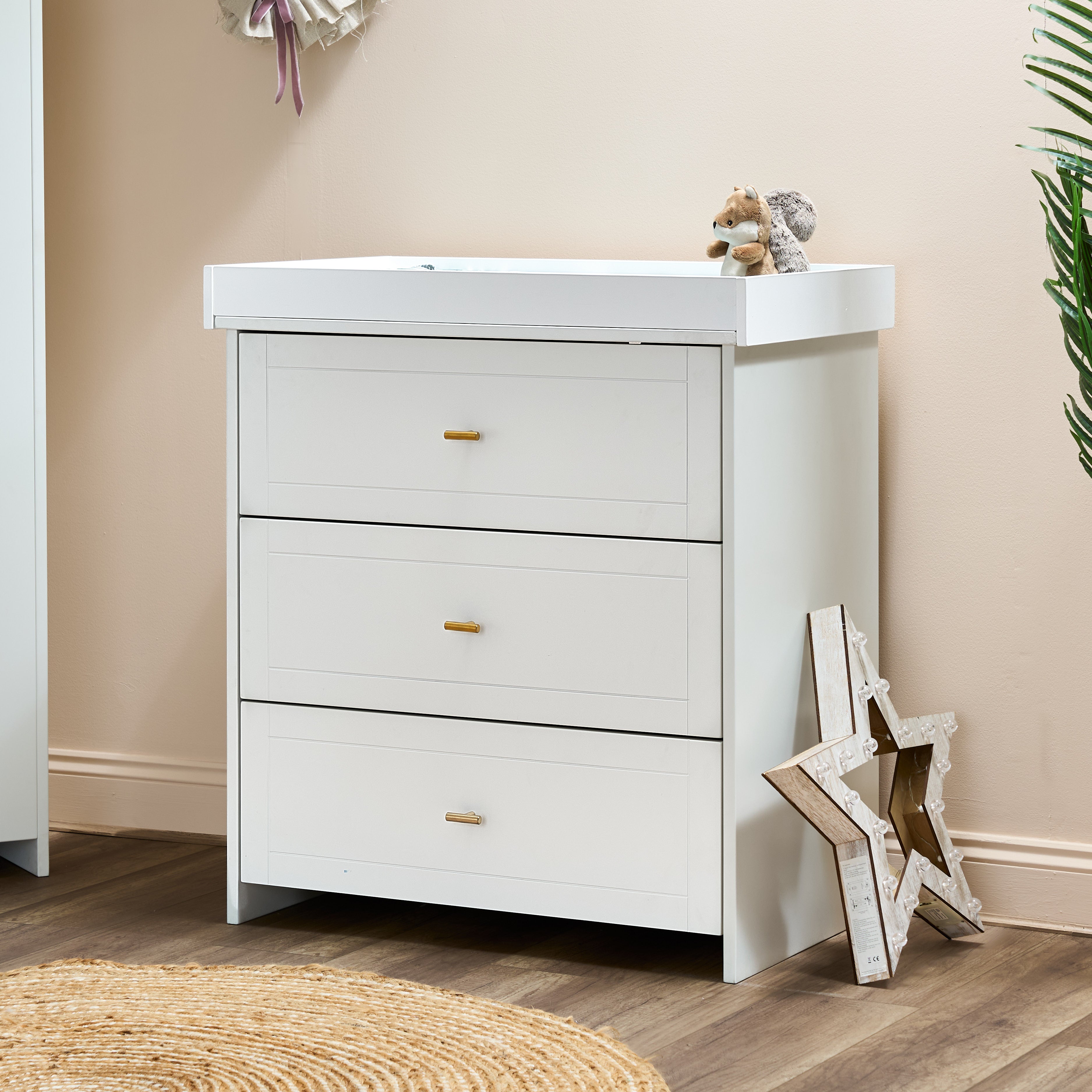 White Changing Unit with gold T Bar handles with changing top fitted.