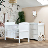 White Mini Cot Bed with solid ends & matching changing unit with 3 drawers finished with gold T bar handle.