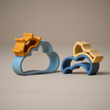 Side view of stacking cloud and sun shapes toy