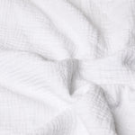 Close-up of white textured muslin fabric