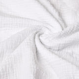 Close-up of white textured muslin fabric