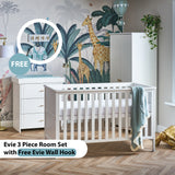 Nursery room set with white cot bed, changing unit, and wardrobe featuring munk & me wall mural. 