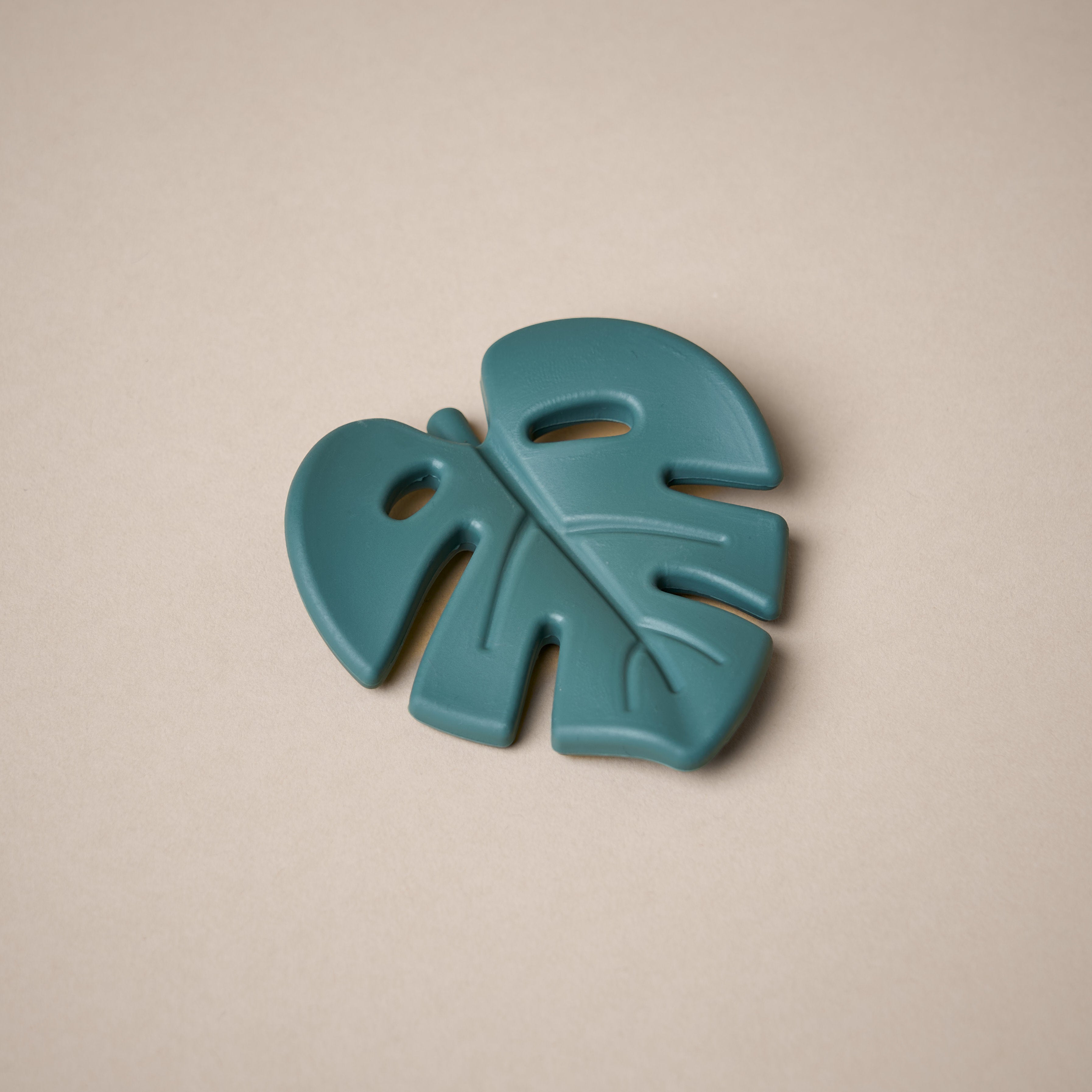 Leaf shaped teether in dark green colour
