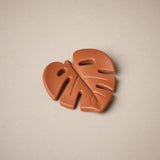 Leaf shaped teether in burnt orange colour