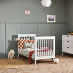 White Cot Bed converted into toddler bed by removing side panels