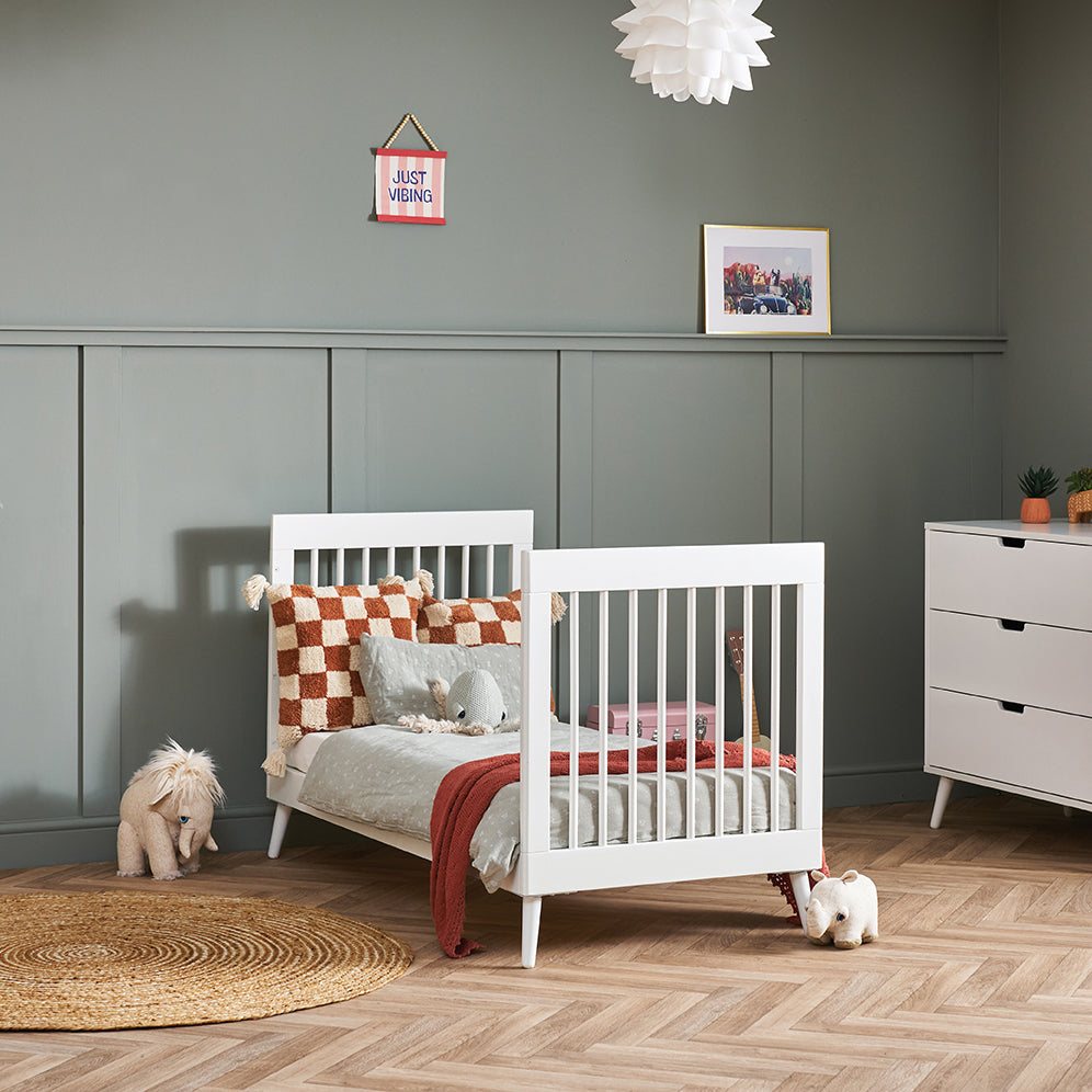 White Cot Bed converted into toddler bed by removing side panels