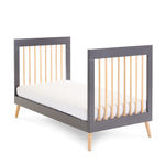 Cot Bed showing it converts into a toddler bed with sides off 