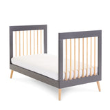 Cot Bed showing it converts into a toddler bed with sides off 