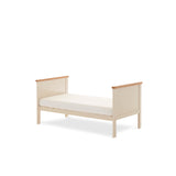Mini Cot Bed in toddler bed mode, with sides removed & solid ends lowered.  