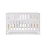 Mini Cot Bed with solid sides, base at middle setting. 