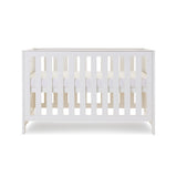 Mini Cot Bed with solid sides, base at middle setting. 
