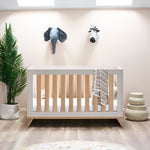 Modern Cot bed in cashmere colour with oat rails & scandi style feet. 
