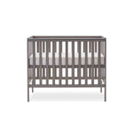 Small cot with base on the new born setting level. with all 4 sides open rails. 
