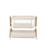 bedside crib on Tallest setting, oatmeal fabric with mesh sides, parent side has zipped panel that can be opened for easy access to the baby. wood effect frame & storage basket underneath. Caster wheels to move into position easily. 