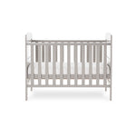 Mini cot bed with solid ends, curved tops, teething rails on the side rails & base on the middle setting. 