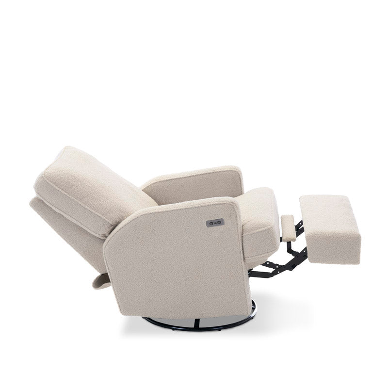 Teddy Ivory Fabric Nursing Chair with electric recline & footrest out showing the swivel base. Armrest has the usb/c charging port next to the recline button. 