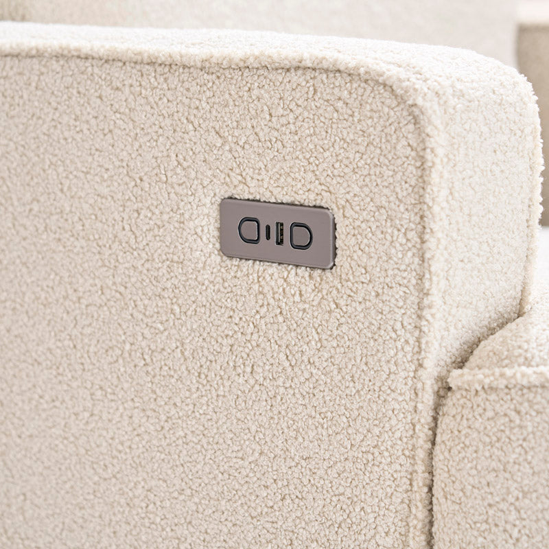 Teddy Ivory Fabric from Madison nursery chair, showing armrest with recline button next to the usb/c charging ports.