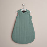 Turquoise muslin baby sleeping bag with press stud around the shoulder & arms 