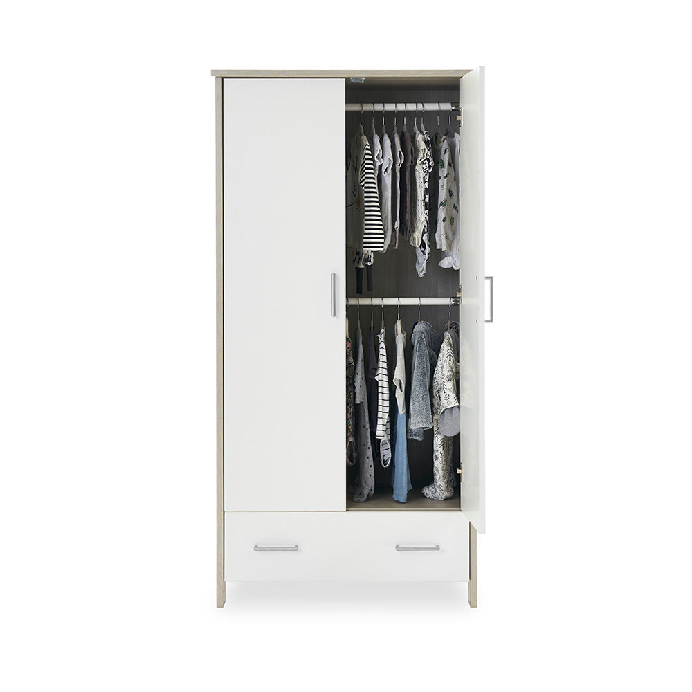 Compact Double wardrobe with 1 door open showing baby clothes handing on 2 rails inside. 